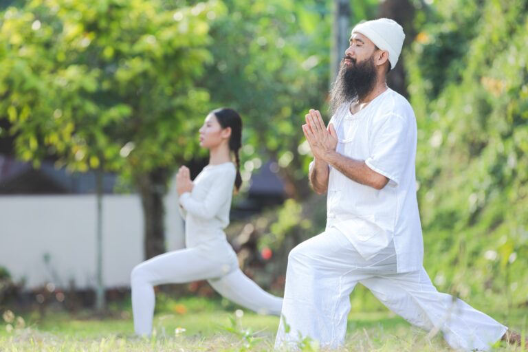 two-people-white-outfit-doing-yoga-nature-scaled